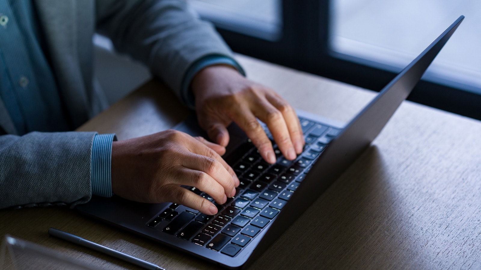 A person preparing an old laptop for a complete factory reset before selling it
